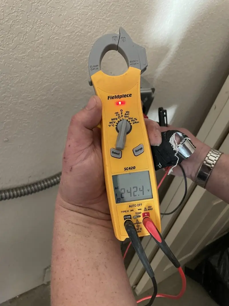 Voltage testing with clamp meter during Ceiling Fan Installation in Plano